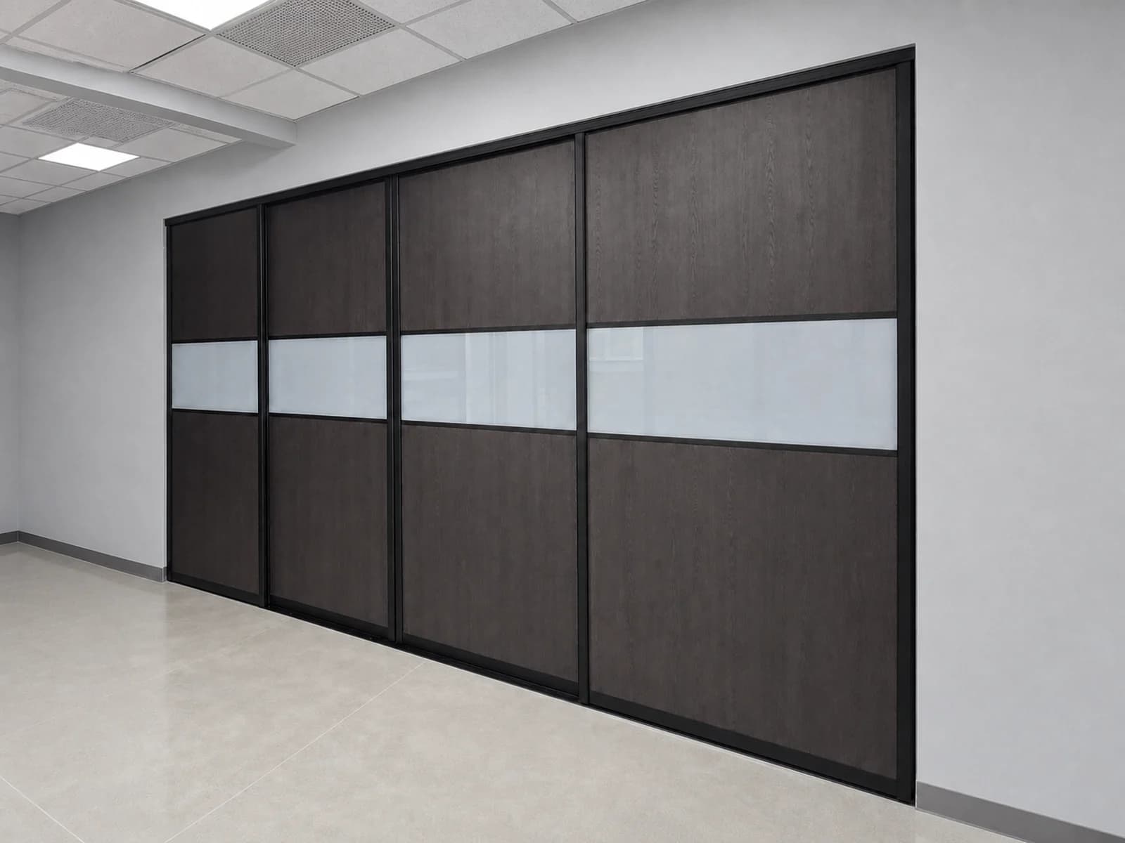 Four extra-wide black-framed sliding doors with dark wood and frosted laminated glass panels.