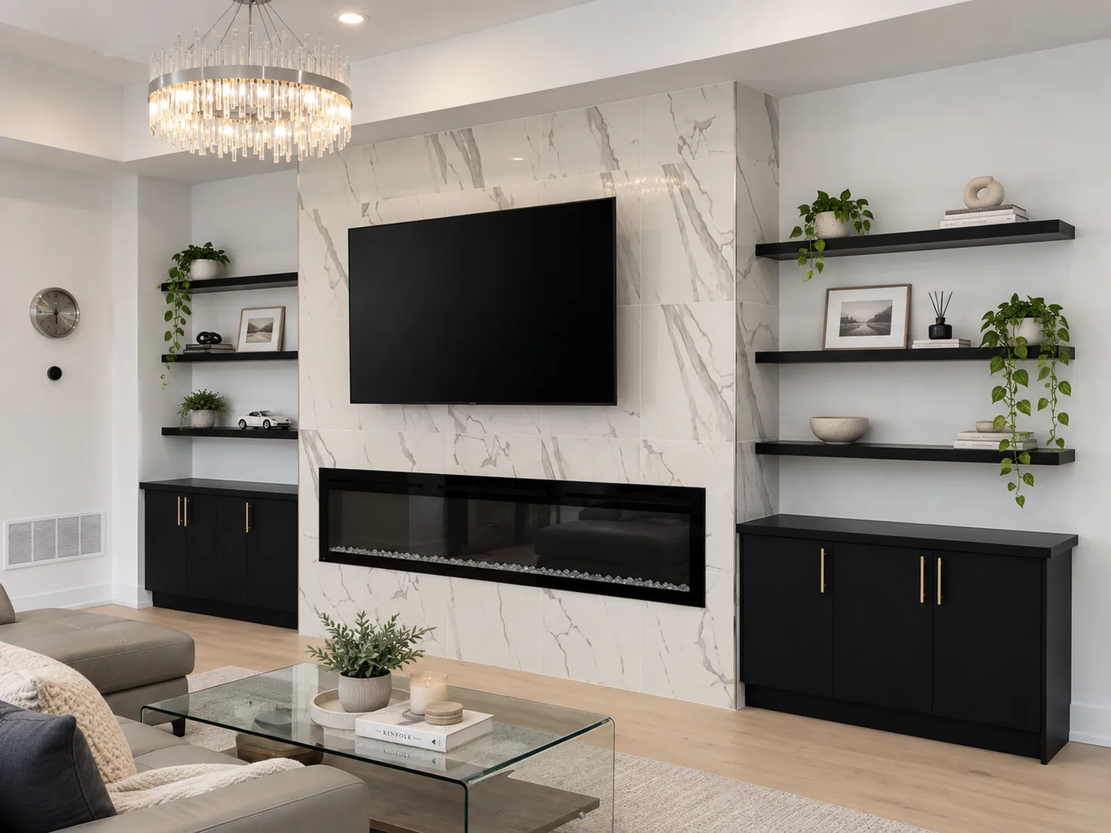 Completed Roomidea TV wall with black media cabinets, floating shelves, a marble-look surround, open display space and concealed storage