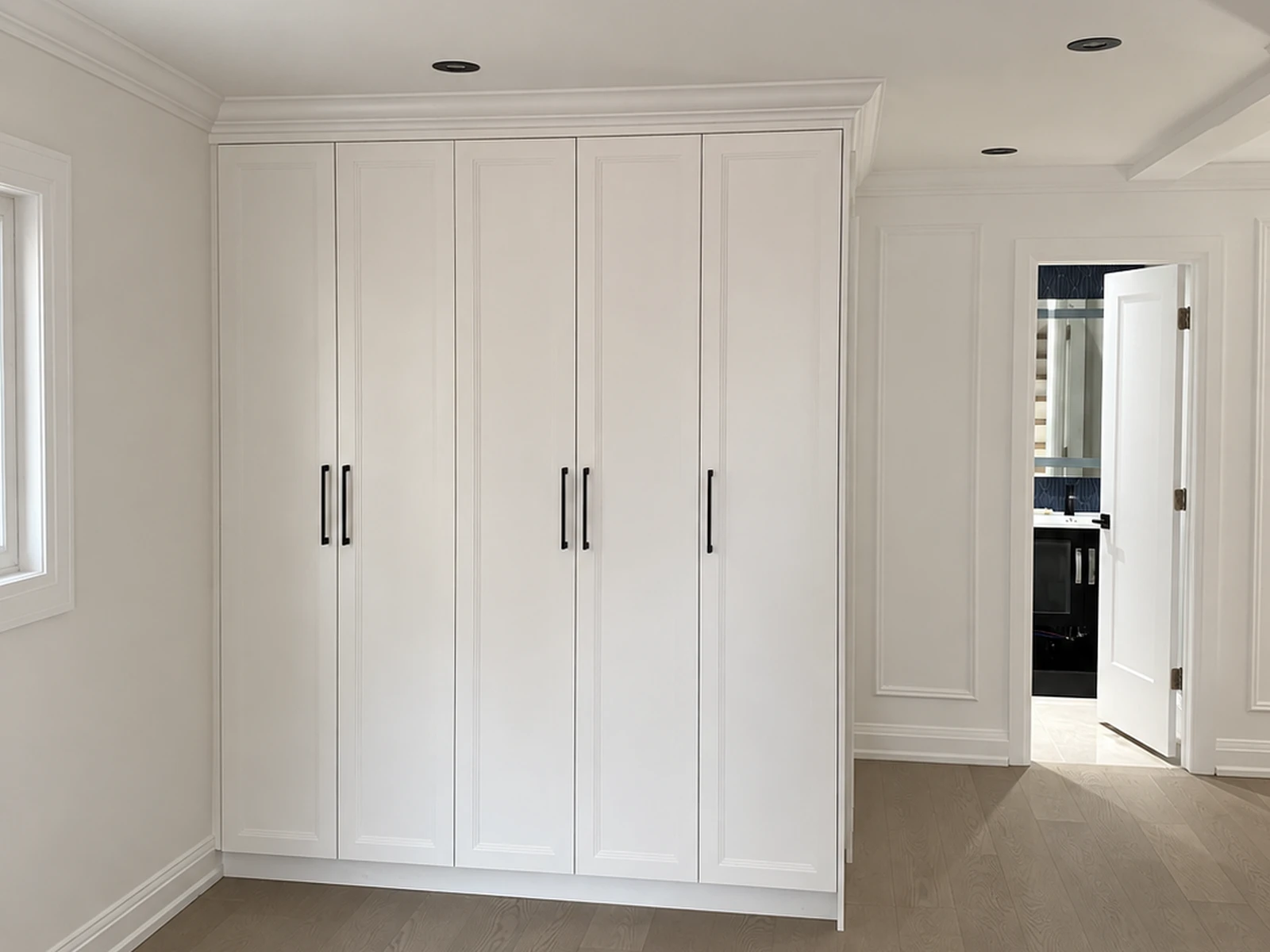 Double Shaker wardrobe with crown moulding and one exposed finished side