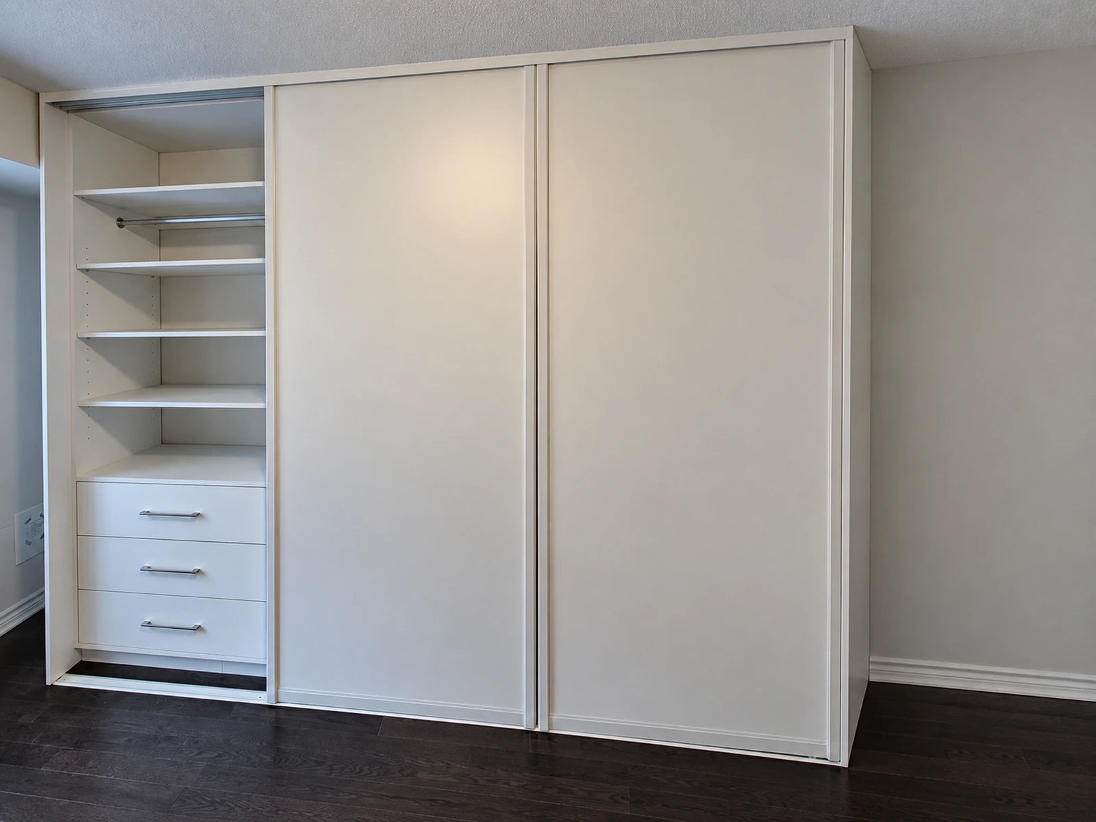 Freestanding wardrobe with two finished sides and sliding doors