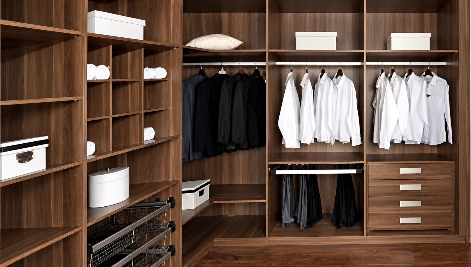 Dark wood walk-in closet with storage arranged along two adjoining walls.