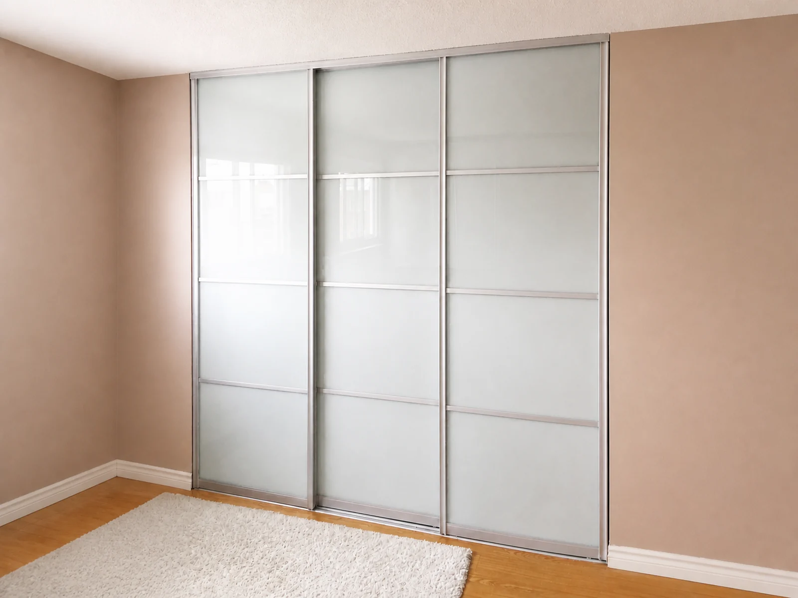 Three frosted laminated-glass closet sliding doors installed on a two-track opening.